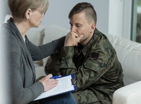 Counselor Helping a Veteran Counselor Helping a Veteran