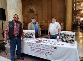 A Visitor with Dave Sassman and Don Hawkins at the Legislative event at the Capital