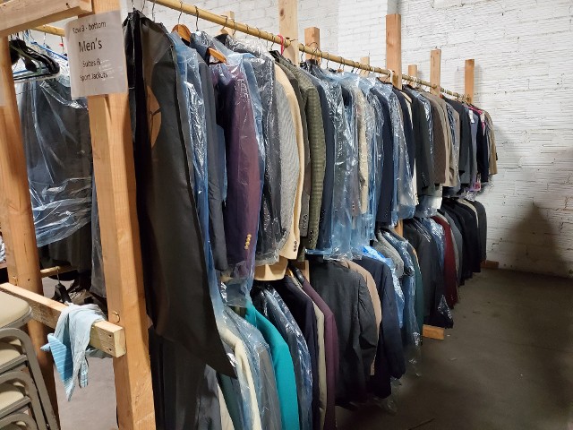 Section 7 of VSC & HRH's warehouse - Men's suits from the Men's Warehouse