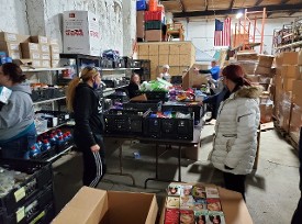 Volunteers sorting donations from CVS Volunteers sorting donations from CVS