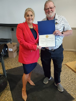 David Sassman presenting Jill Fewell with a Letter of Appreciation from Congressman Andrew Carson